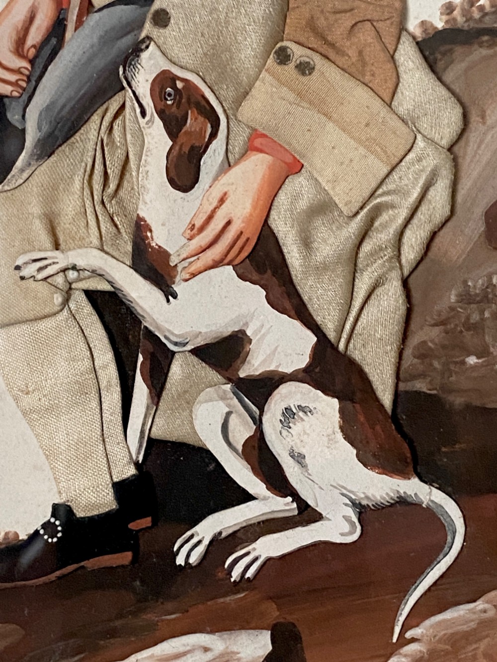 A late 18th-century Georgian folk art picture depicting a seated gamekeeper in fabric attire resting his hand on a spotted dog. View VII