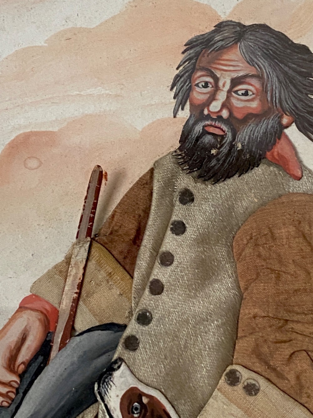 A late 18th-century Georgian folk art picture depicting a seated gamekeeper in fabric attire resting his hand on a spotted dog. View VIII