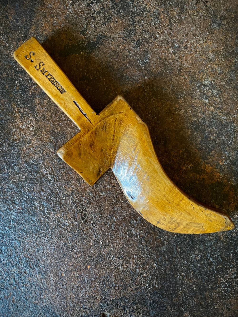 A mid-nineteenth-century carved applewood knitting sheath in the shape of a shoe, featuring the engraved name S. Smithson. View II