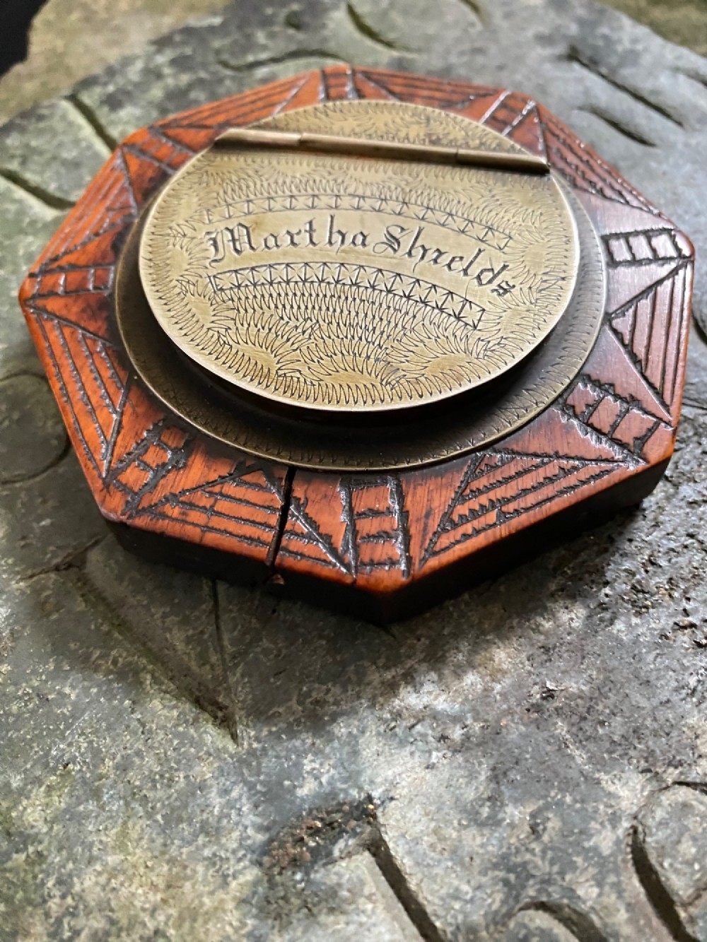 An early nineteenth-century octagonal carved wooden treen snuff box featuring an engraved brass hinged lid inscribed with the name Martha Shields. View III