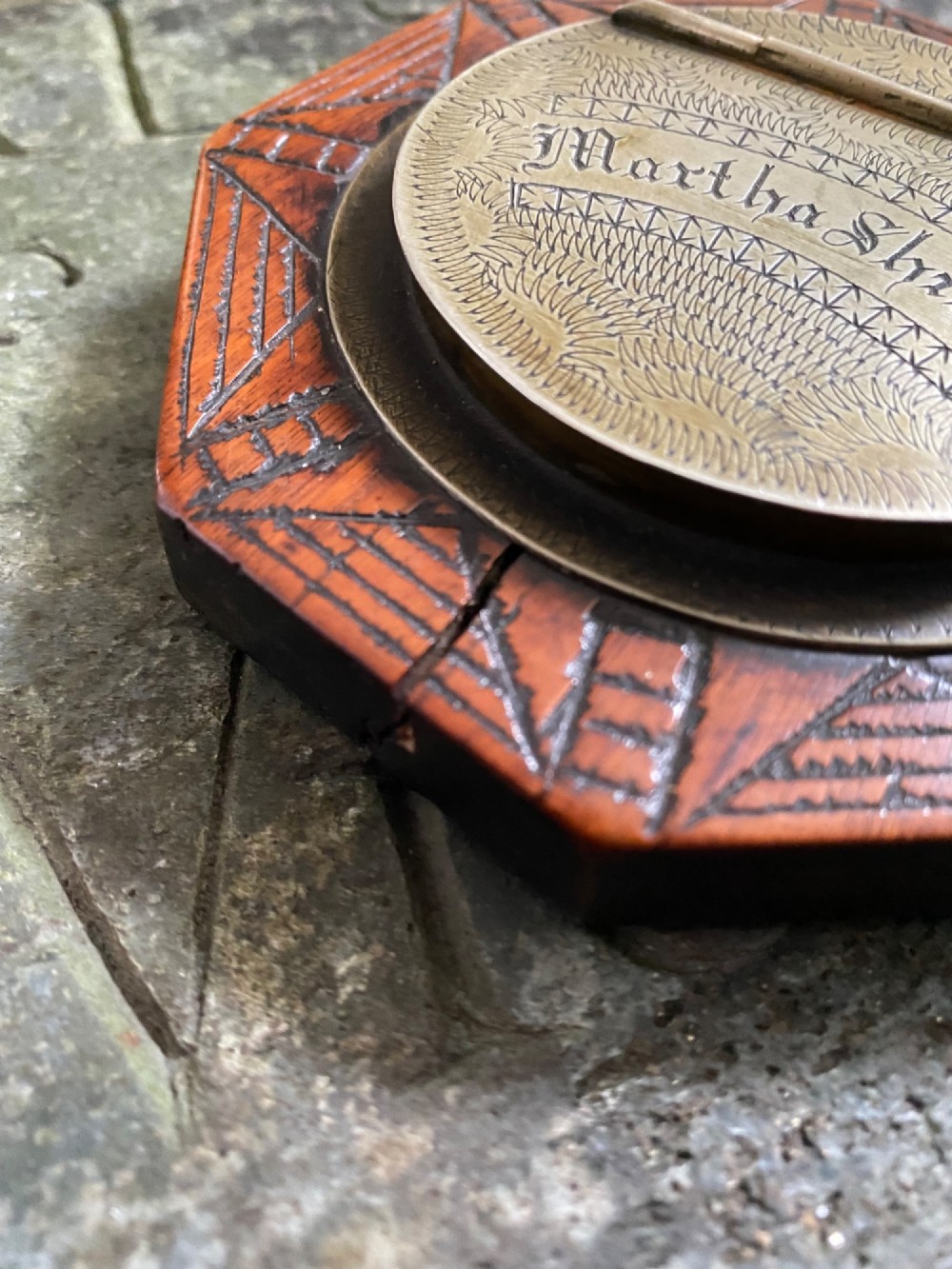 An early nineteenth-century octagonal carved wooden treen snuff box featuring an engraved brass hinged lid inscribed with the name Martha Shields. View VII