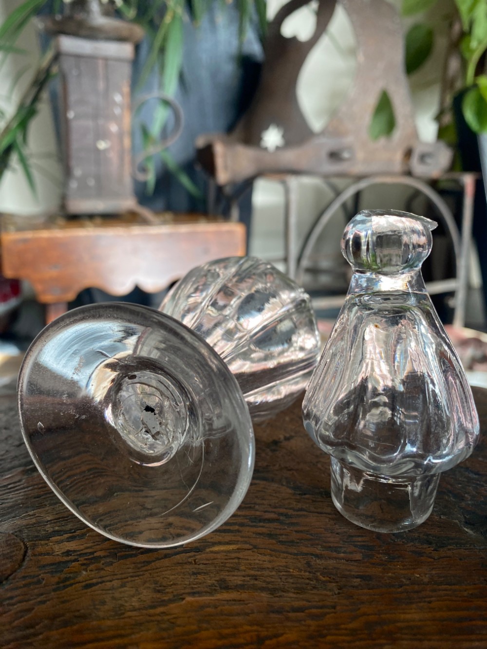 An 18th-century clear hand-blown glass dry mustard jar featuring vertical fluting, a circular footed base, and a removable pointed glass stopper. View III