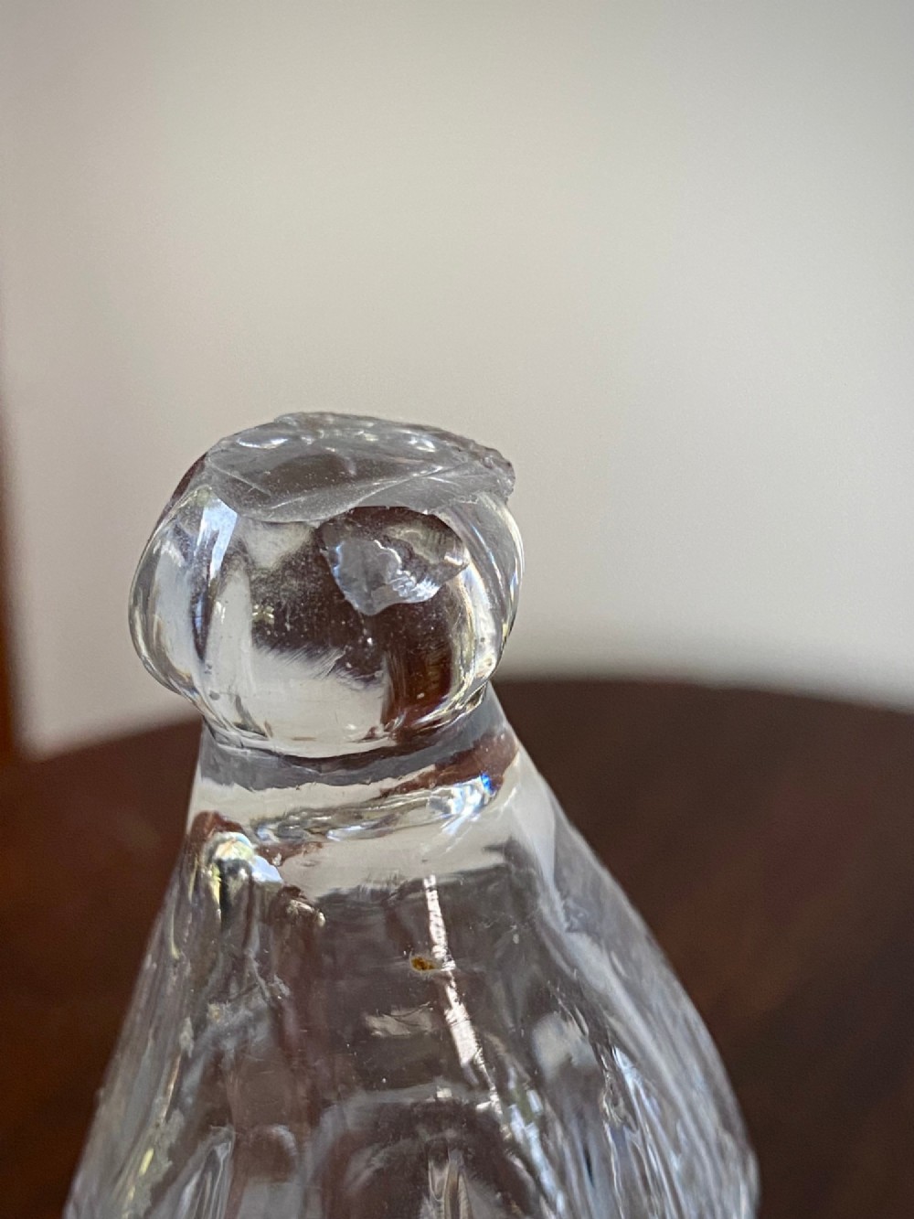 An 18th-century clear hand-blown glass dry mustard jar featuring vertical fluting, a circular footed base, and a removable pointed glass stopper. View VIII