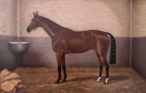 fig 2. An antique Victorian oil painting depicting a bay racehorse standing in profile inside a straw-lined stable stall.