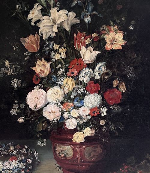fig 2. An antique oil painting depicting a dense arrangement of colourful flowers inside a terracotta-toned urn against a dark background.