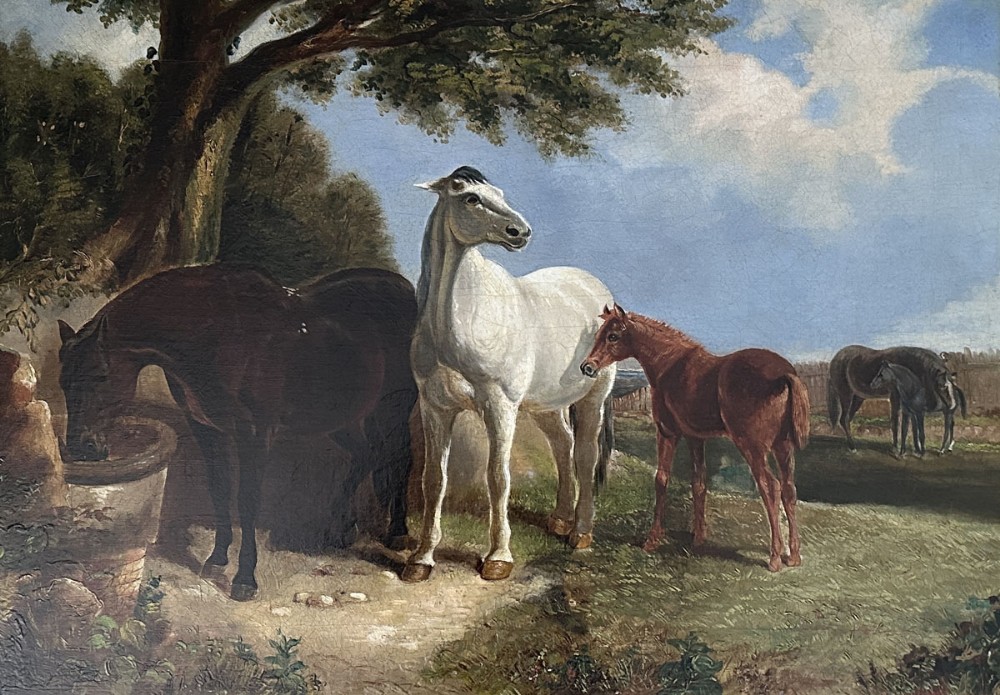An antique oil painting depicting mares and foals gathered near a stone watering trough under a large shady tree.