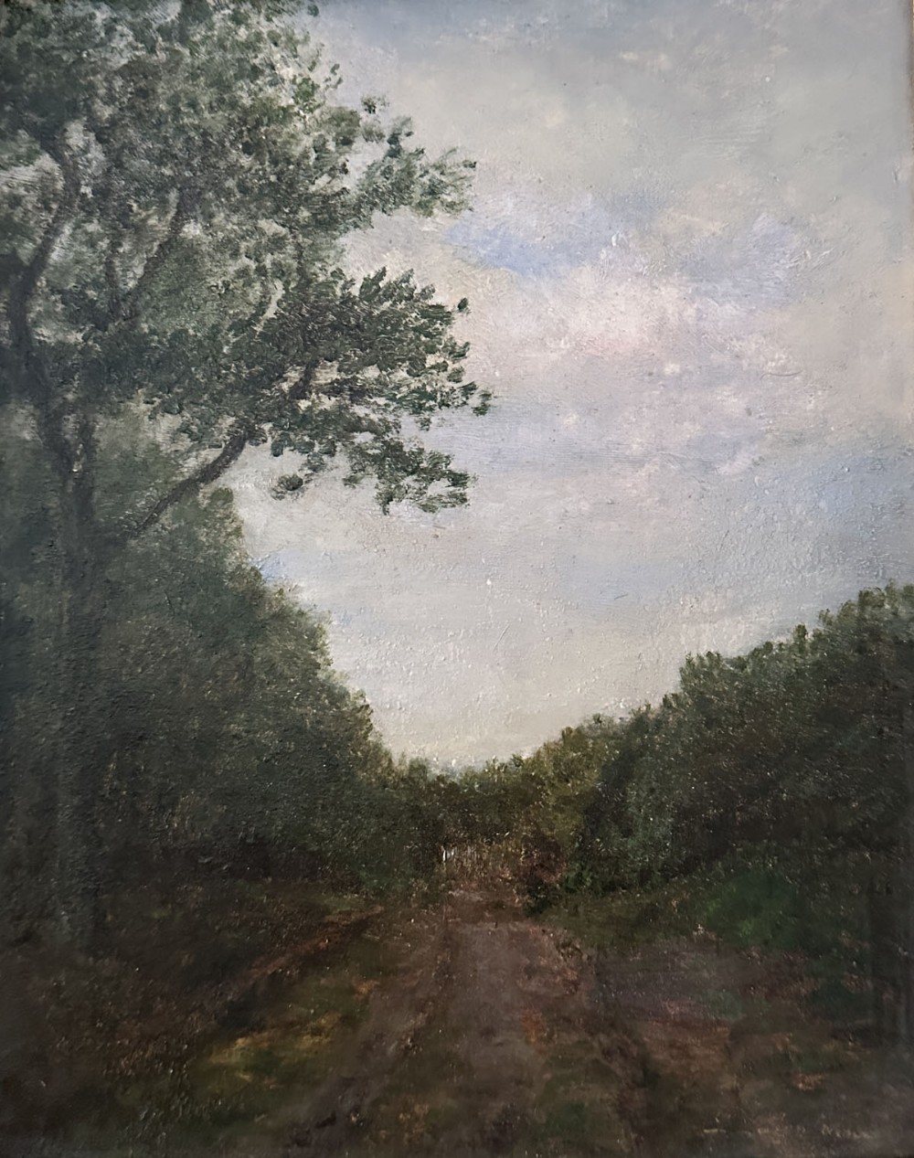 An antique oil painting depicting a shaded dirt track through thick green trees under a pale sky.