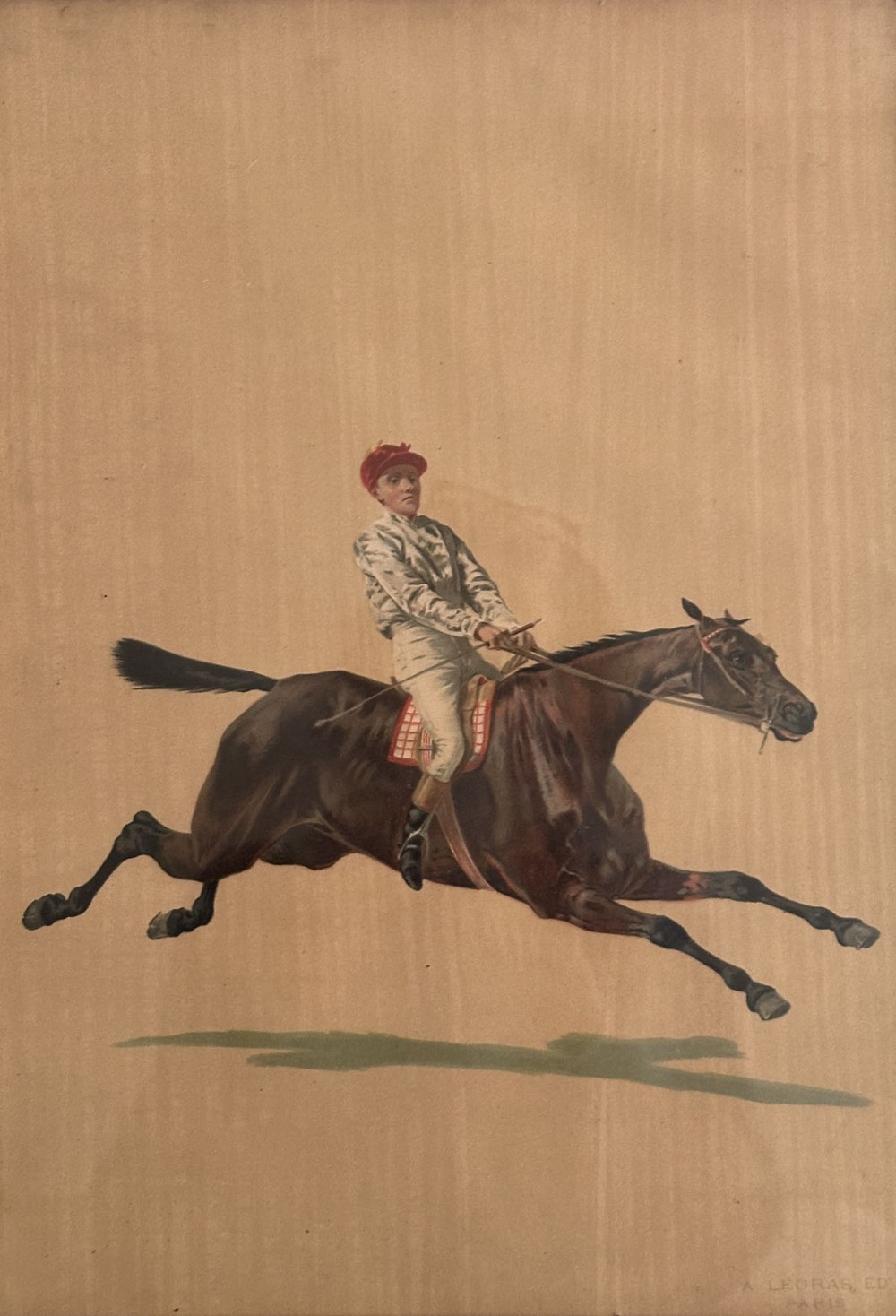 An antique French print depicting a jockey in white silks and a red cap riding a galloping brown racehorse against a plain beige paper background.