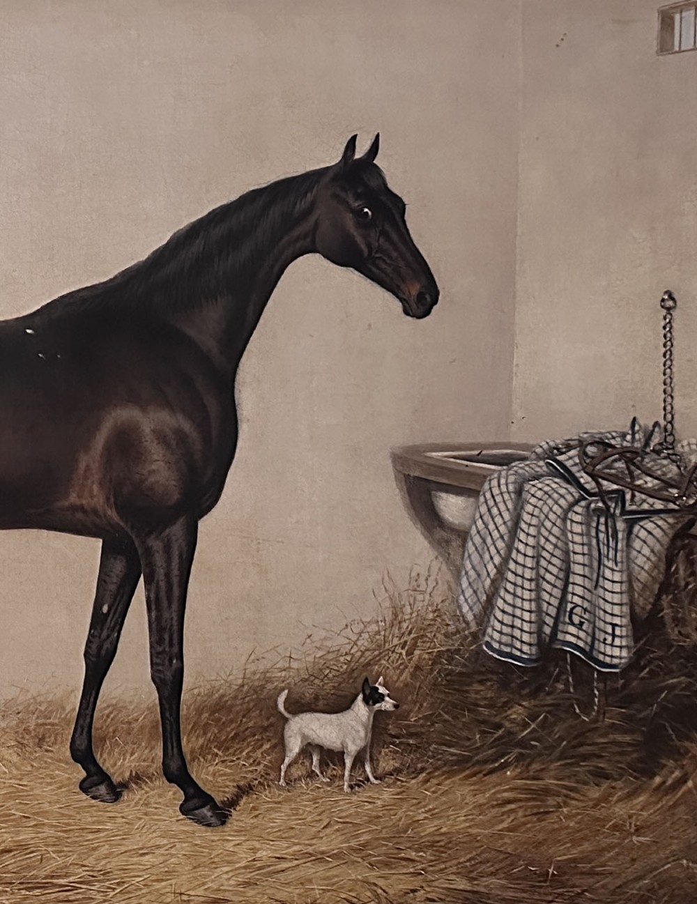 An antique oil painting depicting a dark bay horse standing inside a stable alongside a small terrier dog. View V
