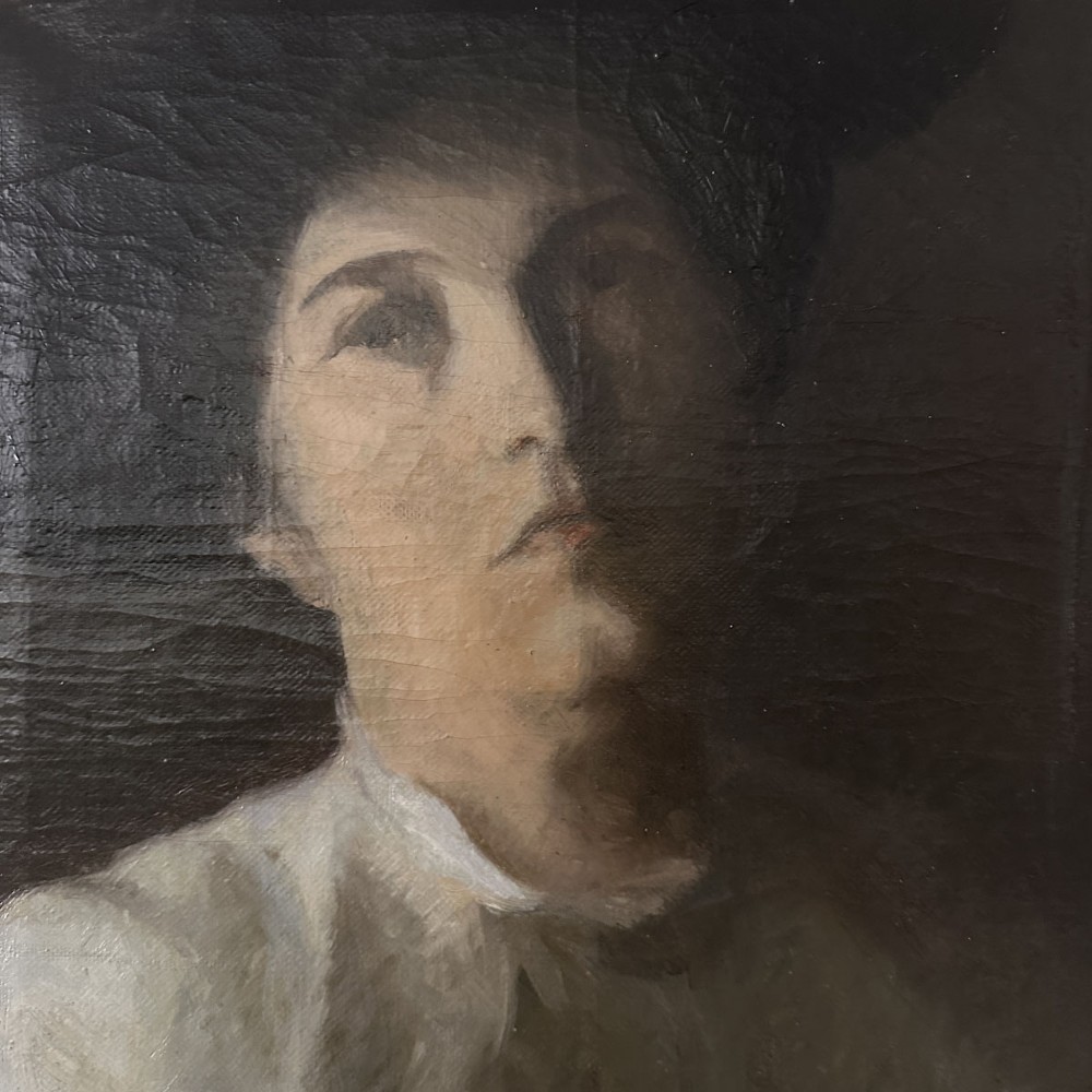 An antique oil painting on canvas depicting a woman wearing a dark hat and light-coloured blouse in low-light illumination. View V