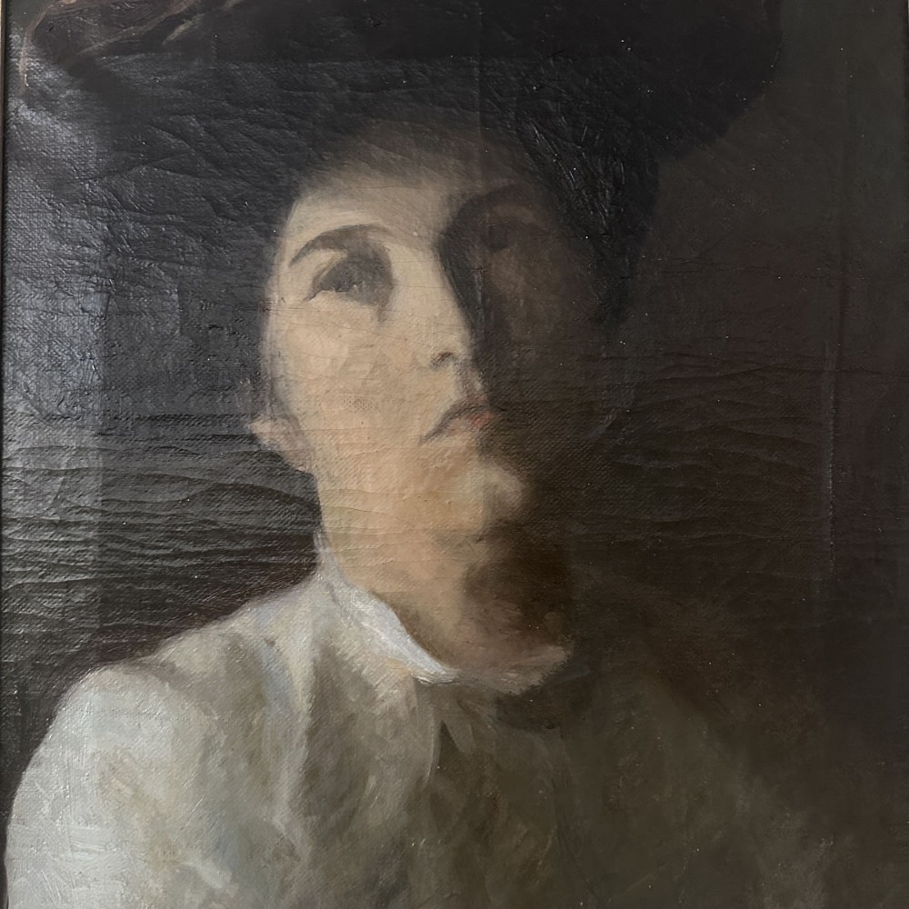 An antique oil painting on canvas depicting a woman wearing a dark hat and light-coloured blouse in low-light illumination. View VI