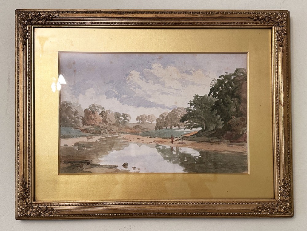 An antique landscape painting depicting a figure fishing along a riverbank surrounded by mature trees under an overcast sky. View II