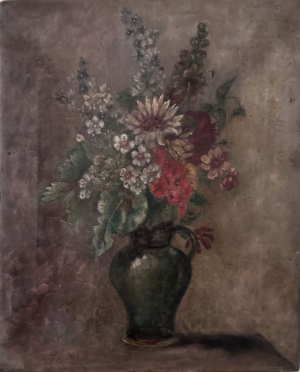An antique oil painting on canvas depicting a mixed bouquet of white, yellow, and red flowers arranged in a dark green vessel against a textured brown background.