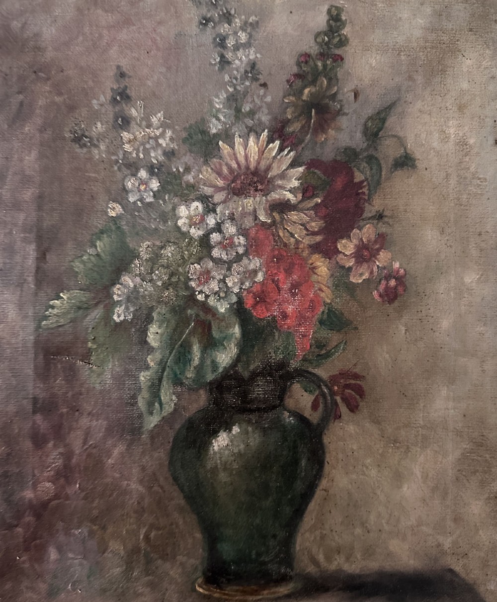 An antique oil painting on canvas depicting a mixed bouquet of white, yellow, and red flowers arranged in a dark green vessel against a textured brown background. View II