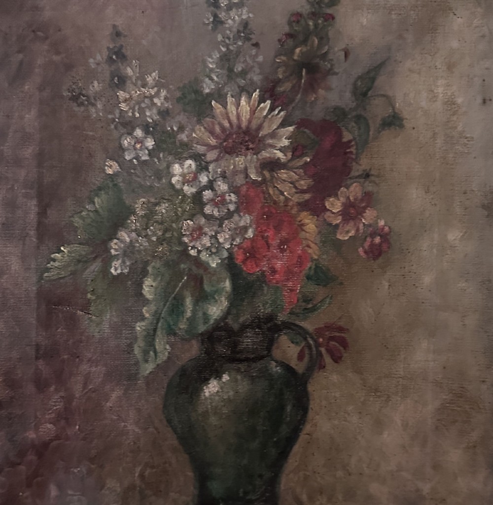 An antique oil painting on canvas depicting a mixed bouquet of white, yellow, and red flowers arranged in a dark green vessel against a textured brown background. View IV