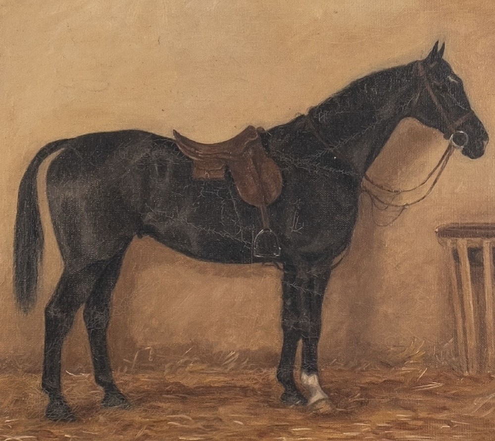 An antique oil painting depicting a saddled black horse standing in profile within a muted brown stable filled with straw. View V