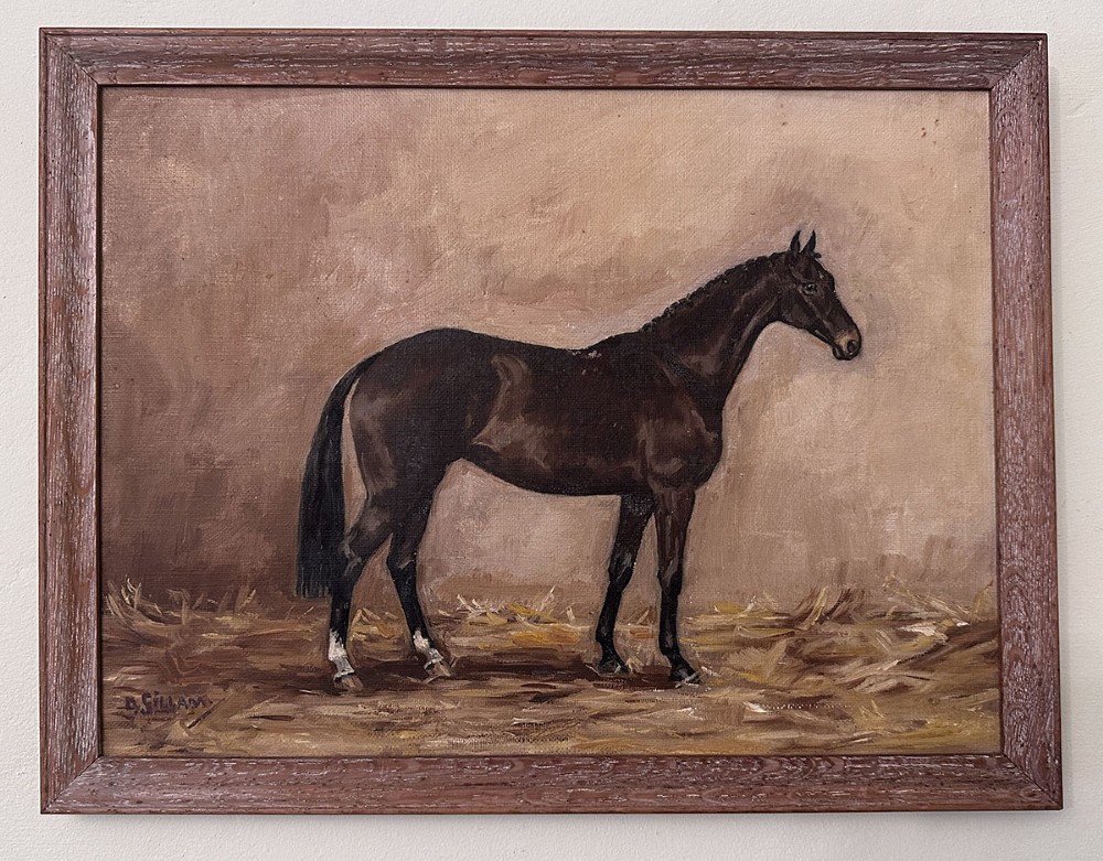 An antique oil painting depicting a dark bay horse standing in profile in a stable on a bed of straw, signed D. Gillam. View II