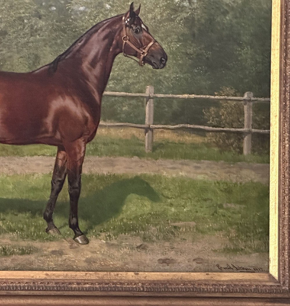 An antique oil painting depicting a bay horse standing in profile wearing a leather bridle in an outdoor paddock in front of a circular building. View IV