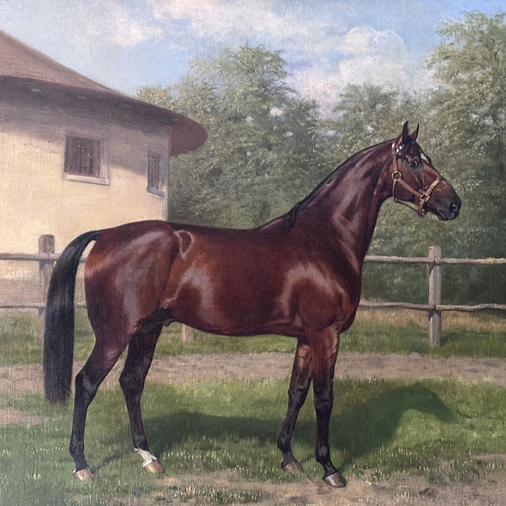 An antique oil painting depicting a bay horse standing in profile wearing a leather bridle in an outdoor paddock in front of a circular building. View VI
