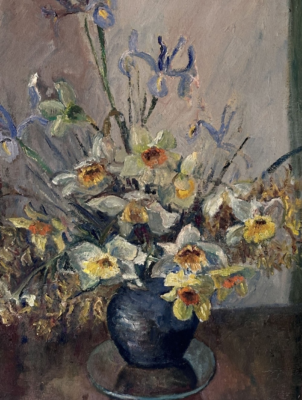 An oil painting on canvas depicting a ceramic vase filled with white daffodils and blue irises resting on a dark surface. View IV