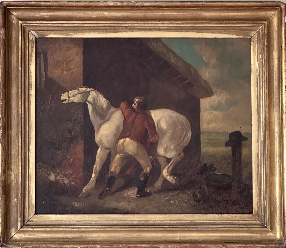 An antique oil painting depicting a groom in a red jacket attending to a white horse beside a rustic barn exterior. View II