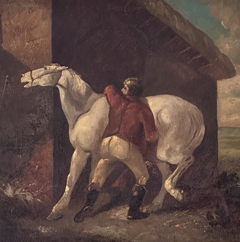 An antique oil painting depicting a groom in a red jacket attending to a white horse beside a rustic barn exterior. View IV