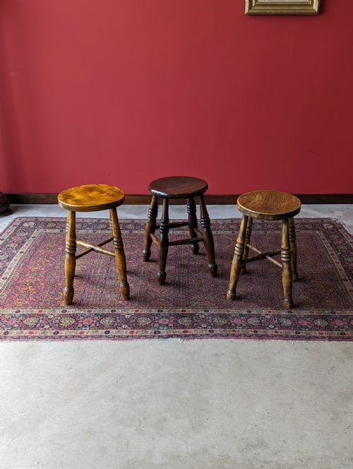 A Harlequin Set of Three Antique Early 20th Century Tavern Stools