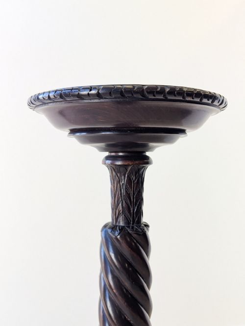 fig 1. A tall Victorian mahogany torchere stand featuring a dish top, spiral-twist column, and tripod base with claw and ball feet.