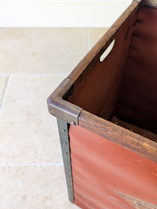 fig 1. An Edwardian industrial mill bin constructed from reddish-brown fibreboard with riveted metal borders and a wooden top rim.