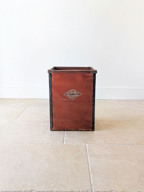fig 2. An Edwardian industrial mill bin constructed from reddish-brown fibreboard with riveted metal borders and a wooden top rim.