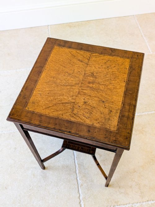 fig 1. A late 18th-century George III square occasional table crafted from dark mahogany with a burr yew inlaid top, tapered legs, and a lower square undertier.