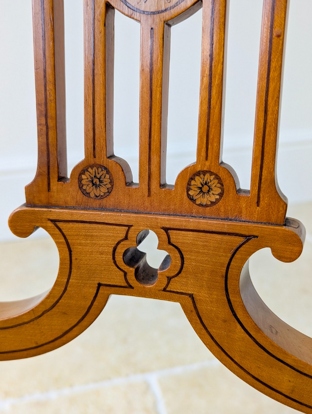 A late Victorian satinwood elbow chair featuring a lyre-shaped backrest with a painted central medallion, turned front legs, and an upholstered seat. View VIII
