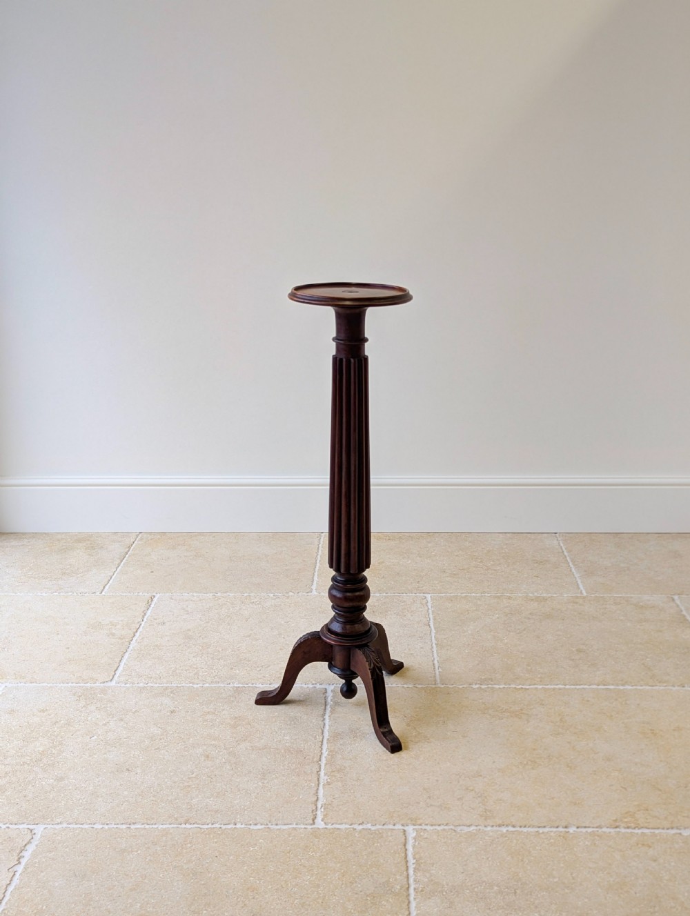 A dark mahogany William IV torchere stand featuring a fluted column shaft resting on a turned tripod base. View II