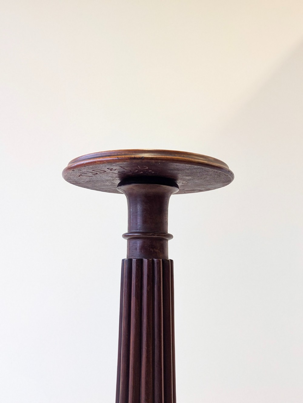 A dark mahogany William IV torchere stand featuring a fluted column shaft resting on a turned tripod base. View III