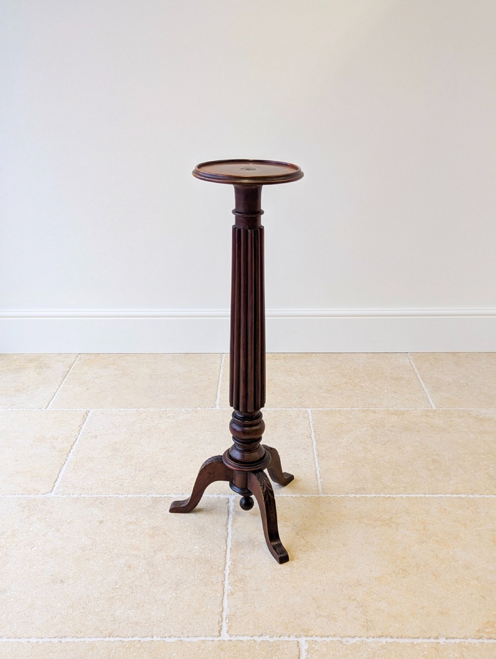 A dark mahogany William IV torchere stand featuring a fluted column shaft resting on a turned tripod base. View IV