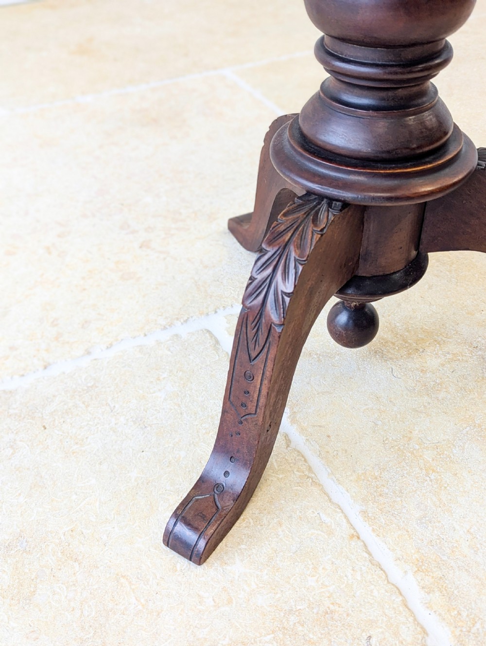 A dark mahogany William IV torchere stand featuring a fluted column shaft resting on a turned tripod base. View V