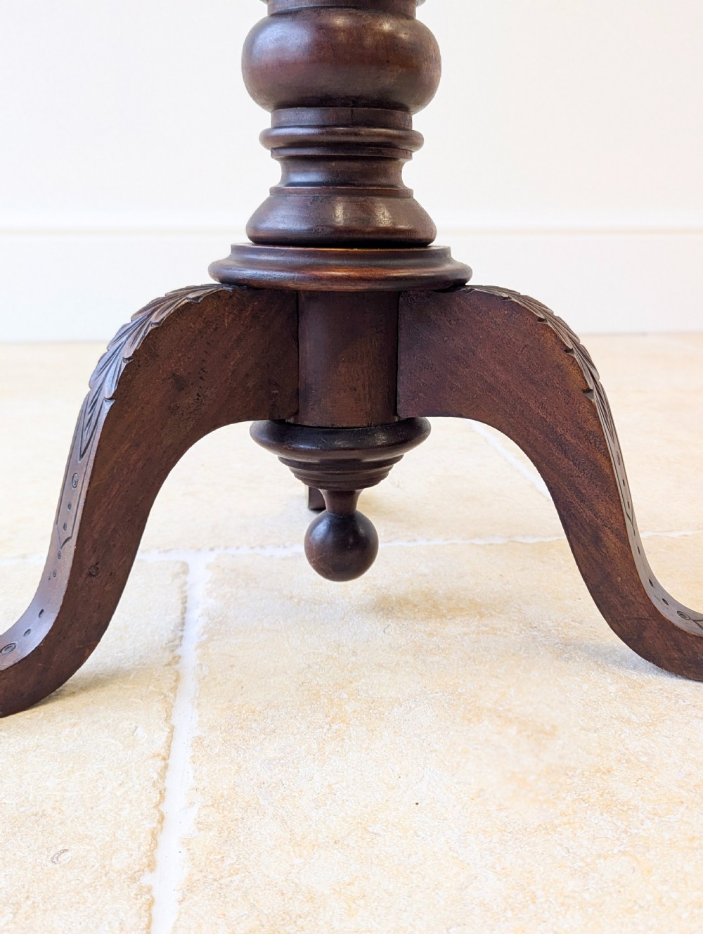 A dark mahogany William IV torchere stand featuring a fluted column shaft resting on a turned tripod base. View VII