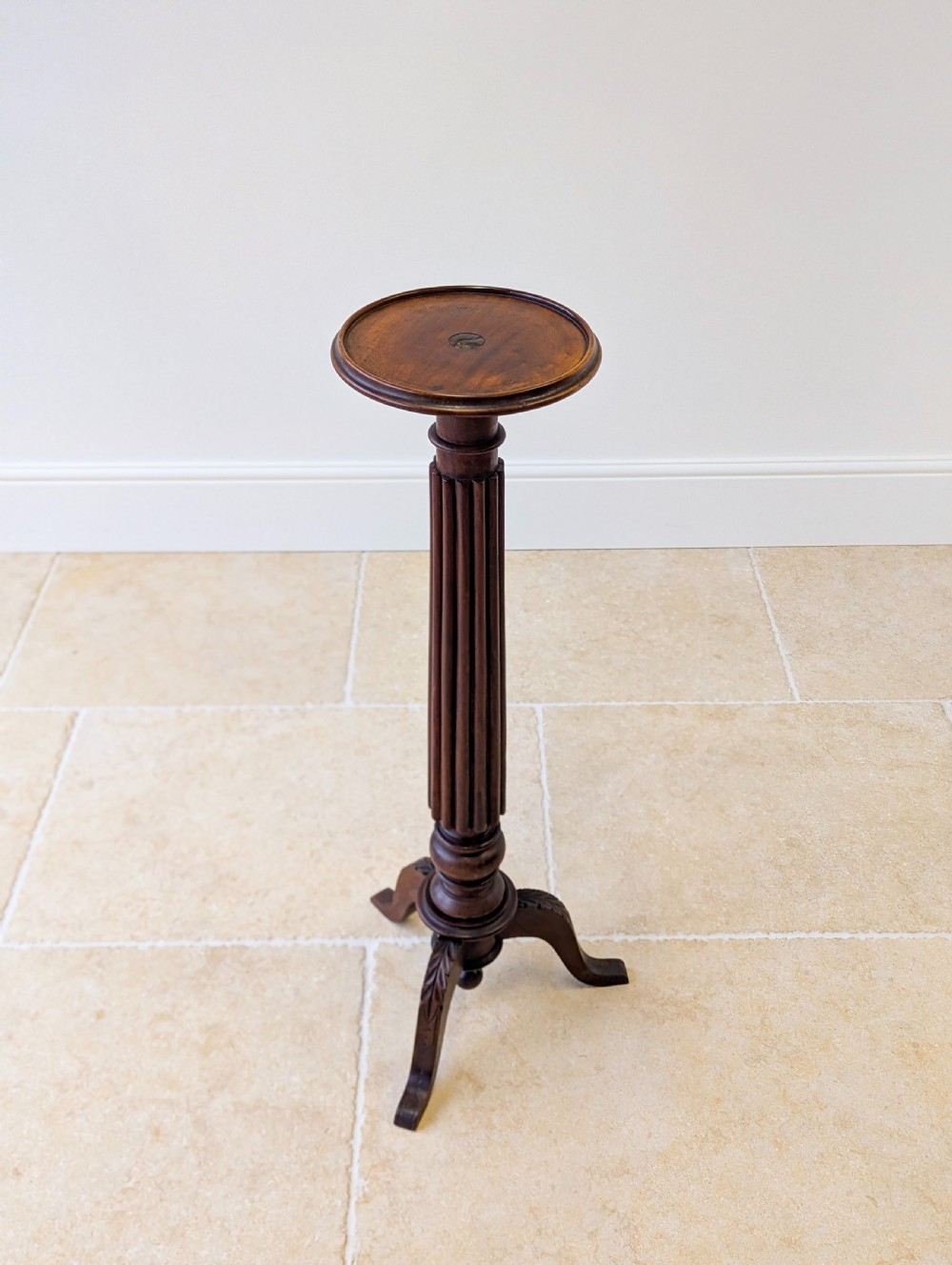 A dark mahogany William IV torchere stand featuring a fluted column shaft resting on a turned tripod base. View VIII
