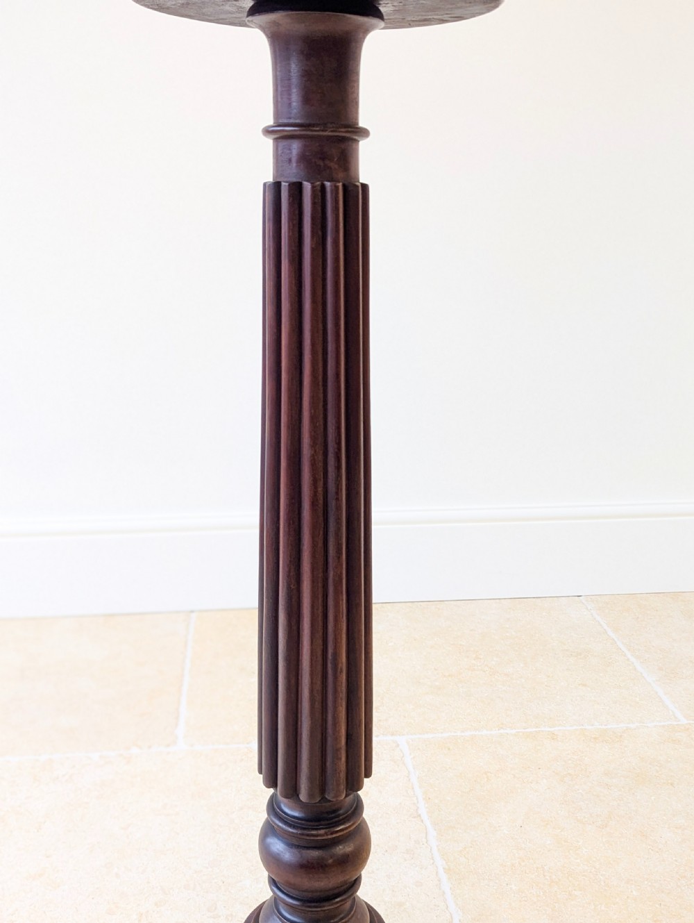 A dark mahogany William IV torchere stand featuring a fluted column shaft resting on a turned tripod base. View XIII