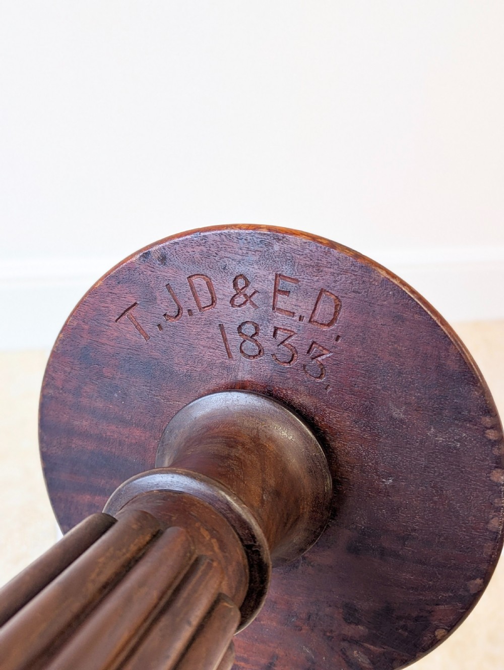 A dark mahogany William IV torchere stand featuring a fluted column shaft resting on a turned tripod base. View XIV