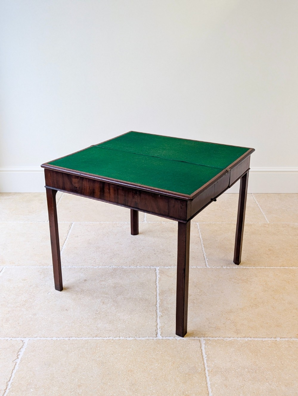 A Regency mahogany flip-top card table with square legs and a flame mahogany frieze. View II