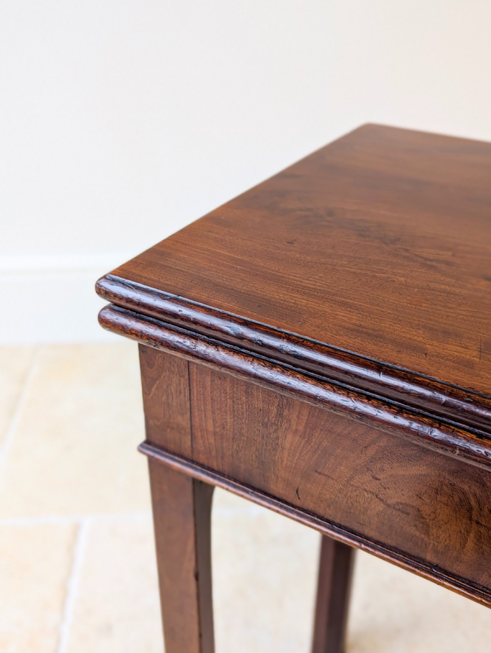 A Regency mahogany flip-top card table with square legs and a flame mahogany frieze. View V