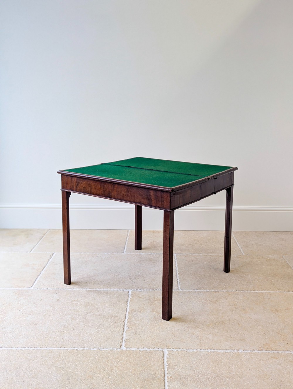 A Regency mahogany flip-top card table with square legs and a flame mahogany frieze. View VI