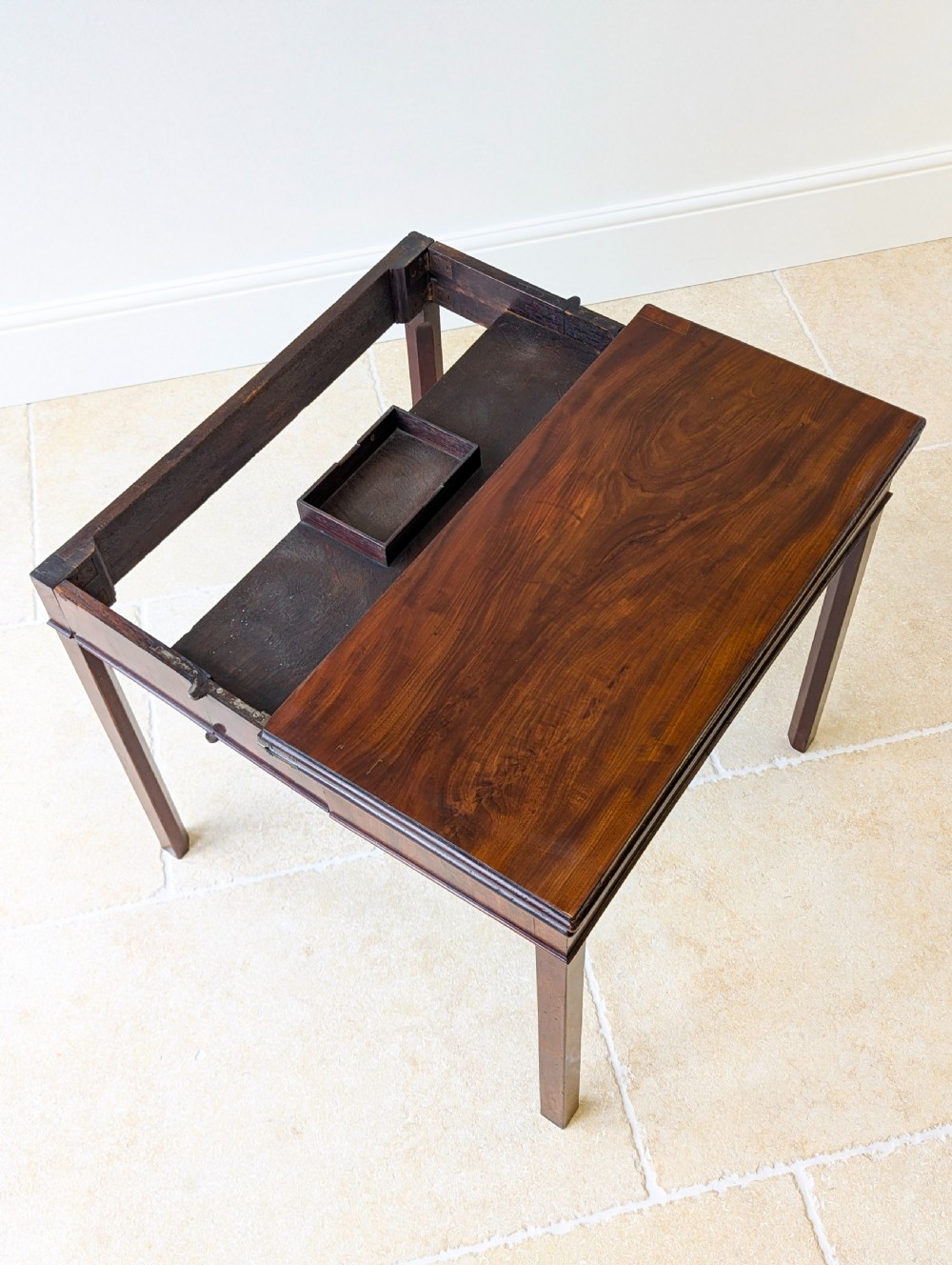 A Regency mahogany flip-top card table with square legs and a flame mahogany frieze. View VIII