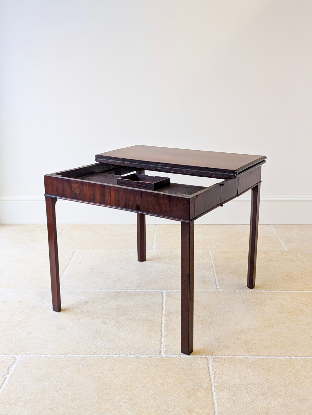 A Regency mahogany flip-top card table with square legs and a flame mahogany frieze. View X
