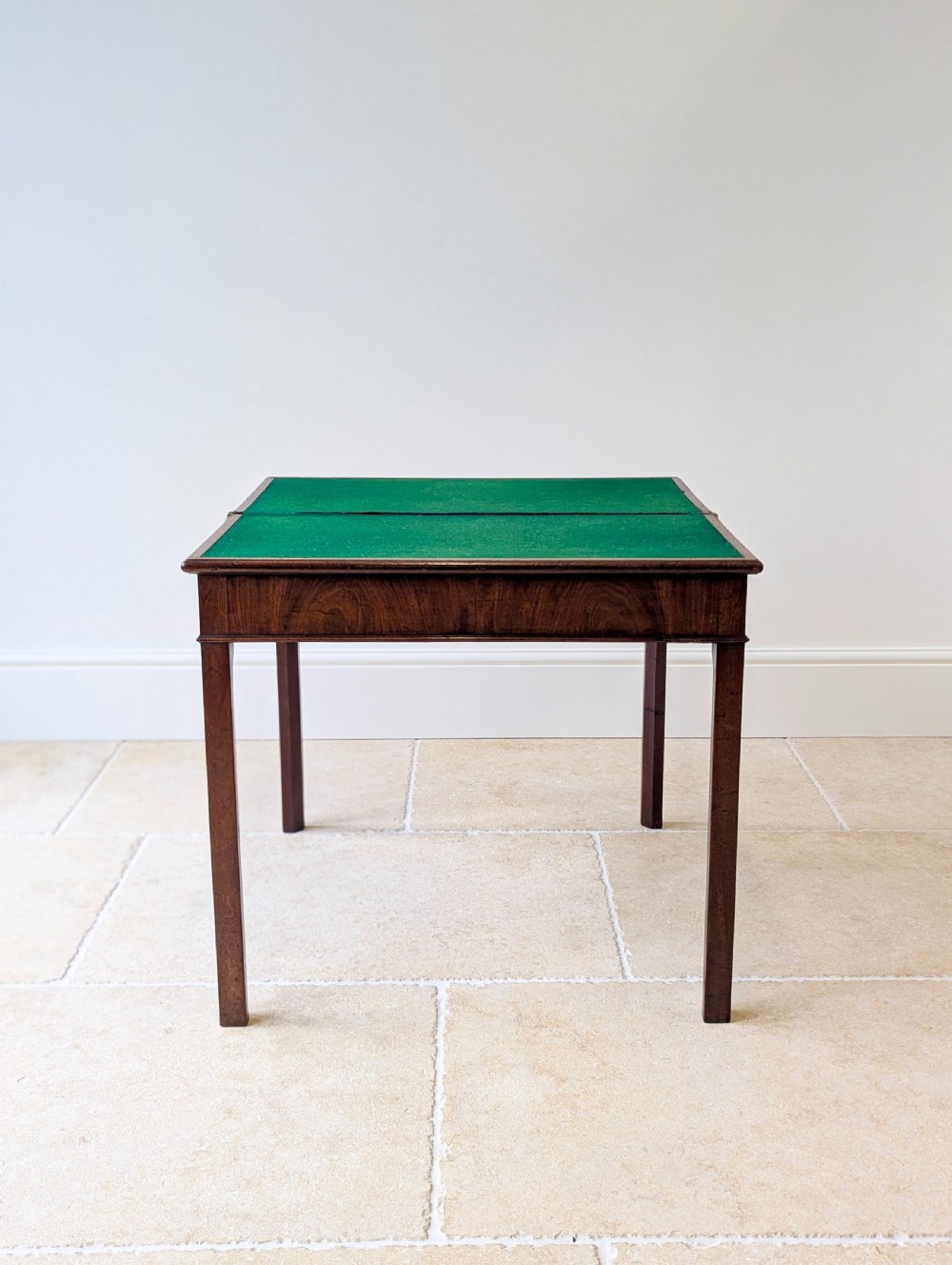 A Regency mahogany flip-top card table with square legs and a flame mahogany frieze. View XII