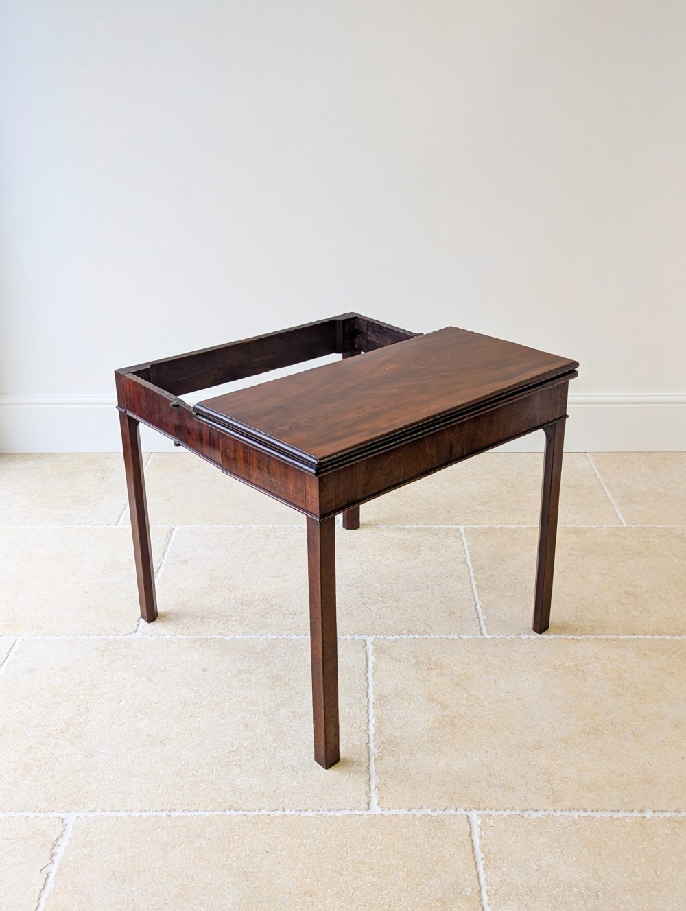 A Regency mahogany flip-top card table with square legs and a flame mahogany frieze. View XVI