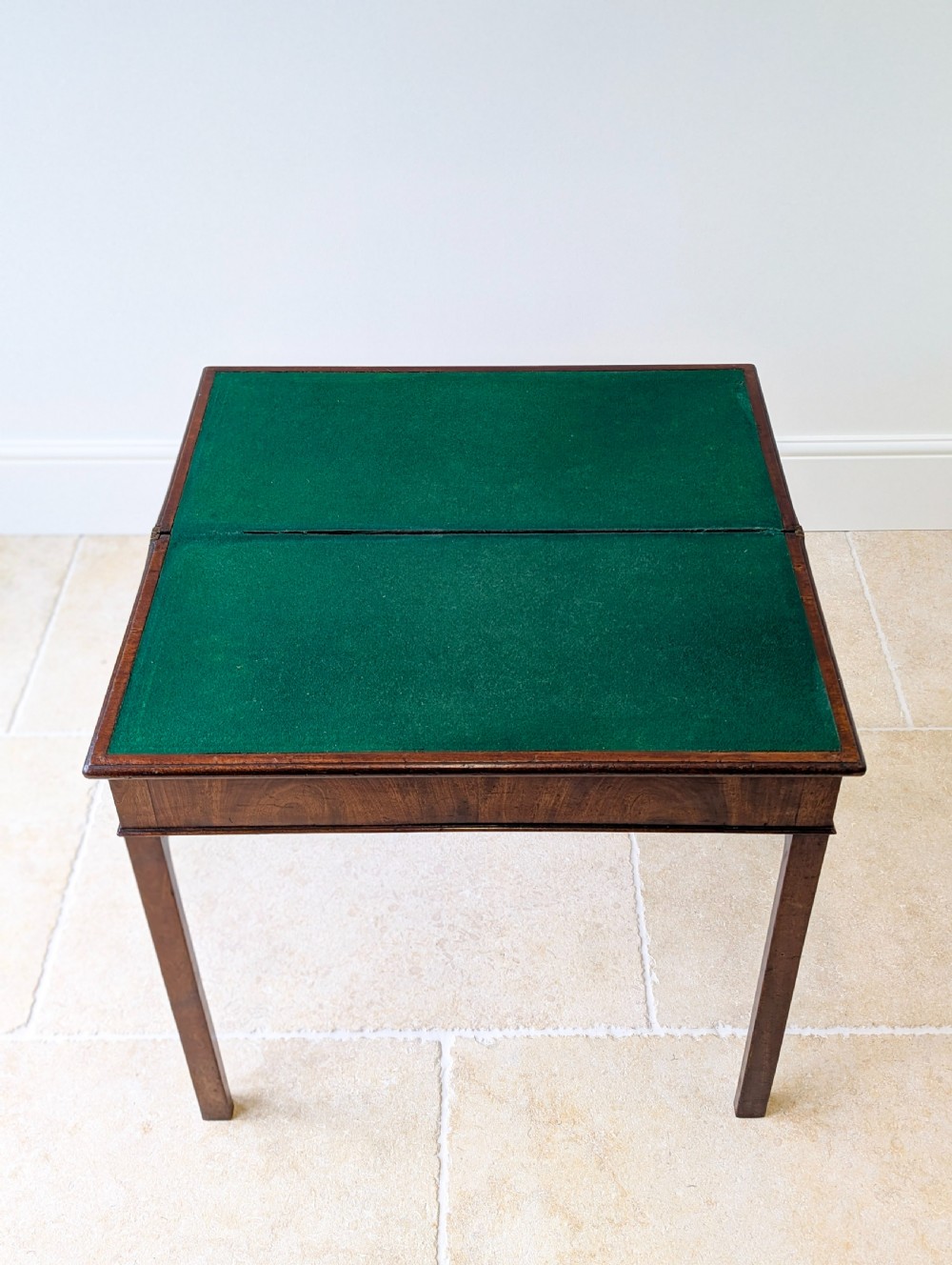 A Regency mahogany flip-top card table with square legs and a flame mahogany frieze. View XIX