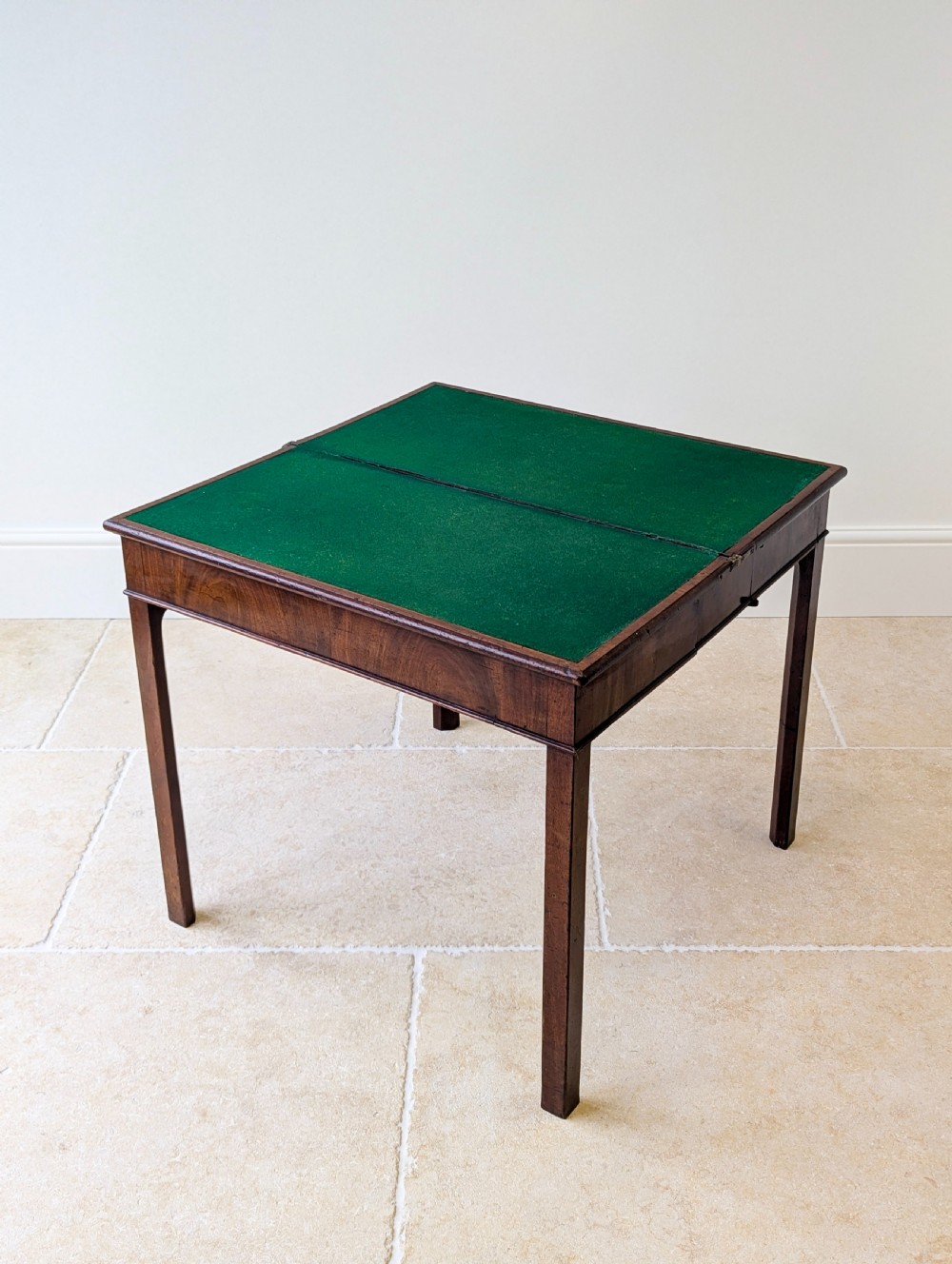 A Regency mahogany flip-top card table with square legs and a flame mahogany frieze. View XX