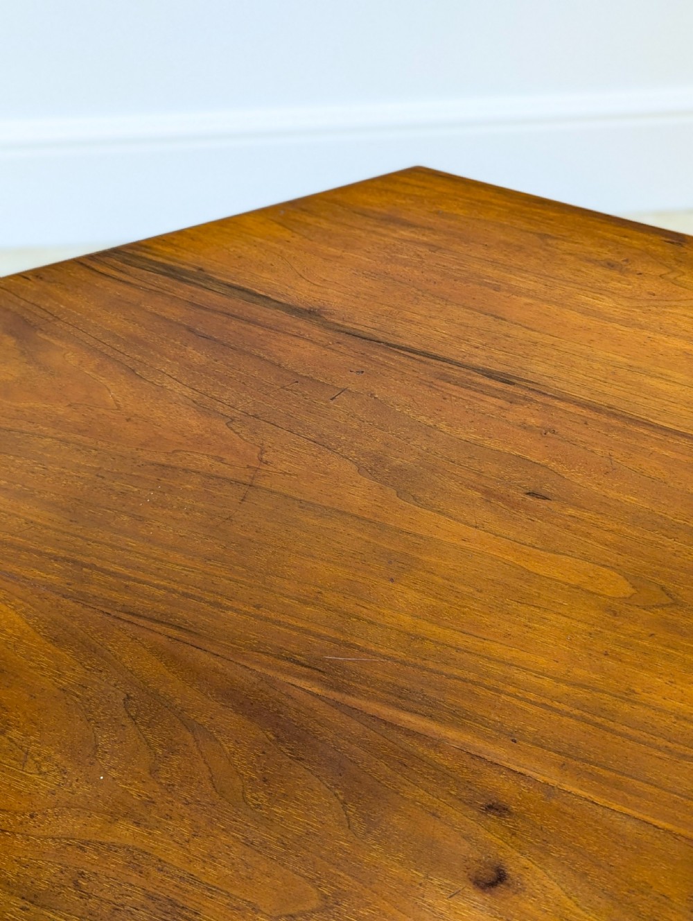 A late Victorian mahogany octagonal centre table featuring turned reeded legs, an intricate X-stretcher with baluster spindles, a central finial, and brass castors. View IX